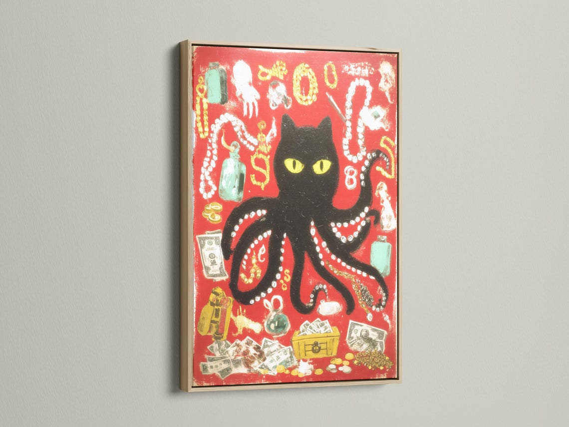 Black cat with yellow eyes in a red octopus-like animal collage with gold and bead-like details detail view