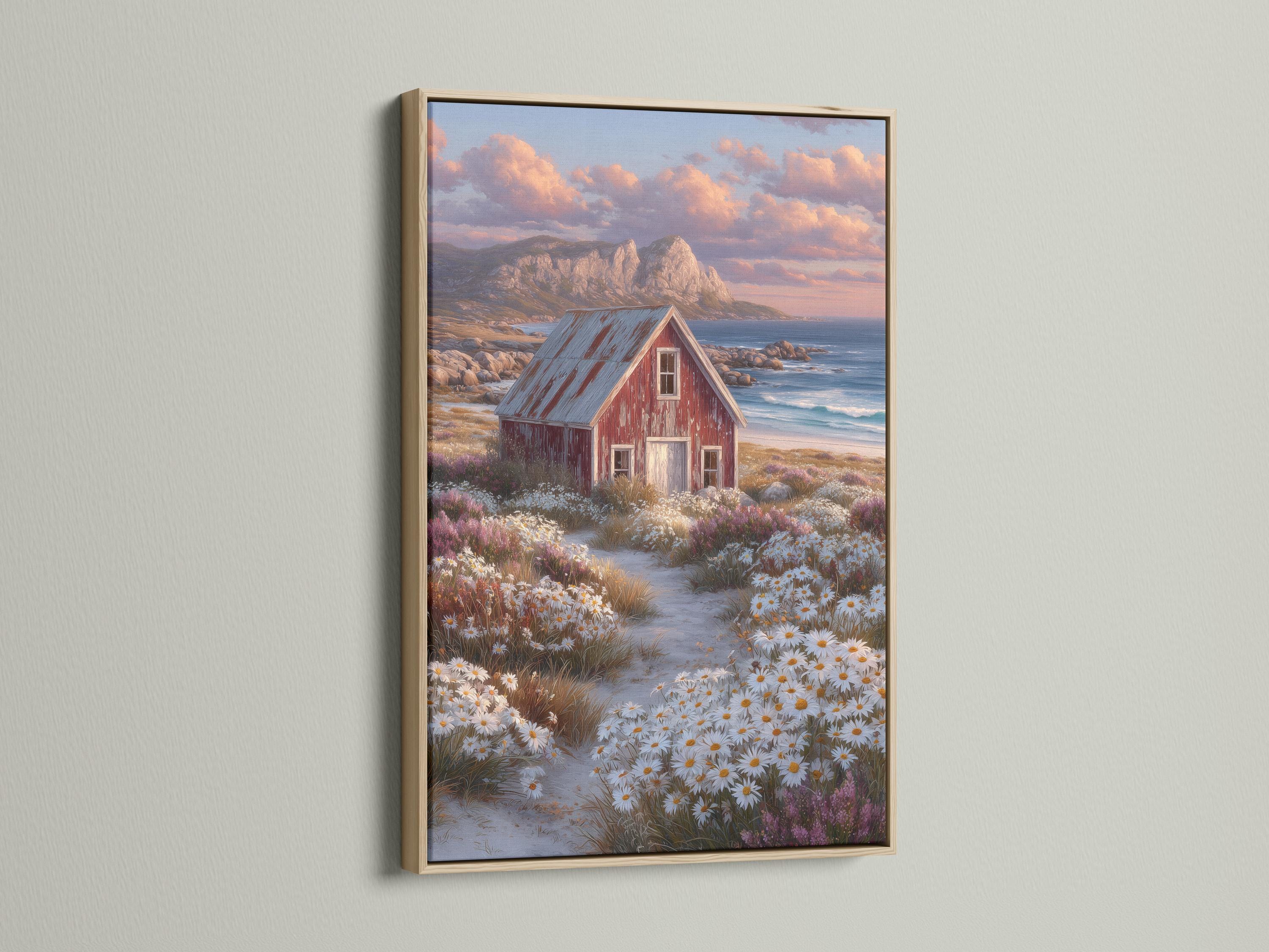 Red barn in a daisy field with ocean and sunset clouds in the background detail view
