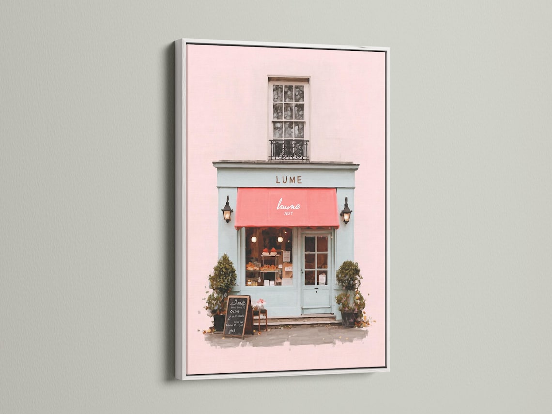 Pastel pink café front illustration with a red awning, lanterns, window and green shrubs detail view