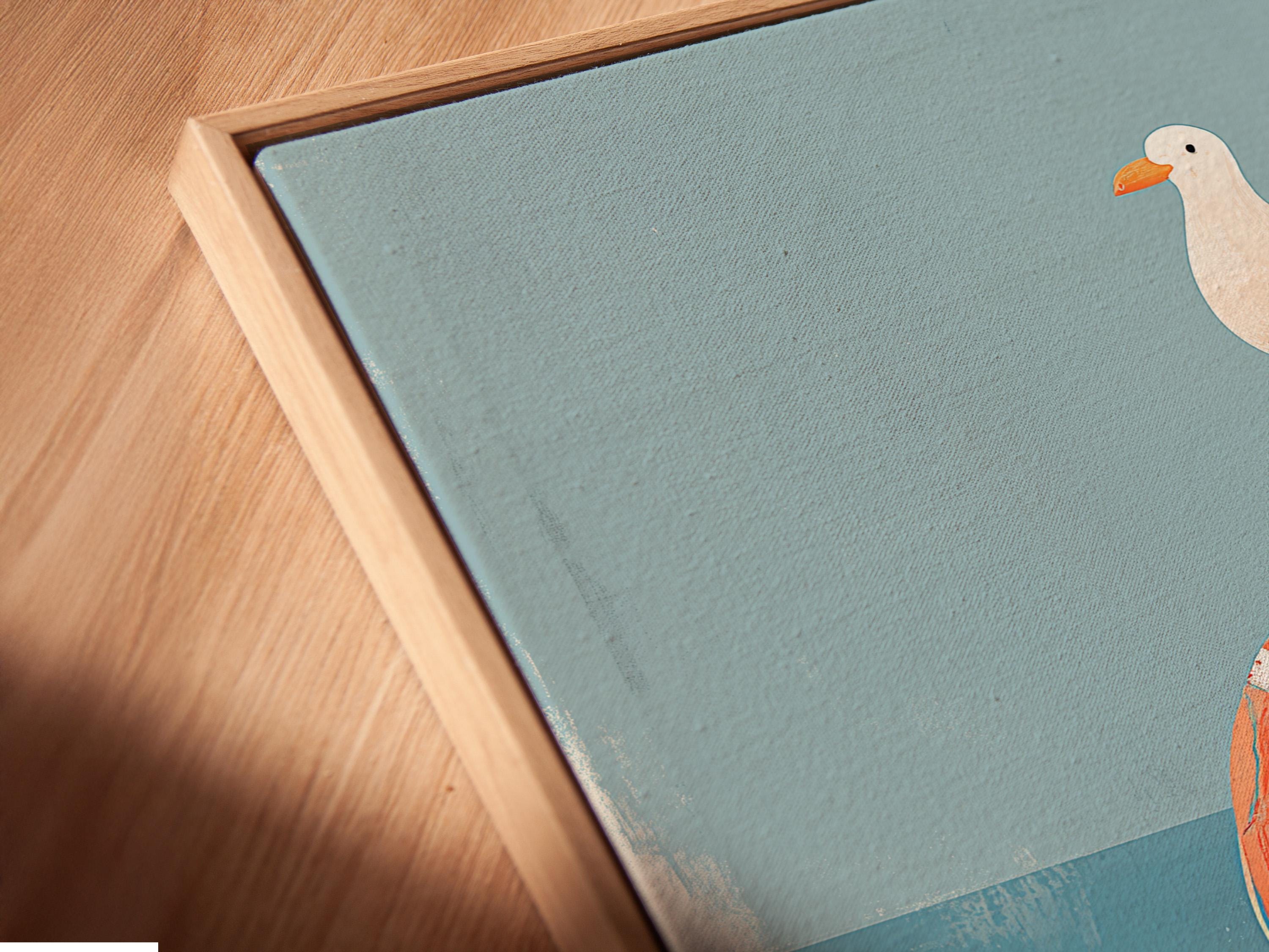 Room mockup featuring framed seagull and lifebuoy artwork with blue waves and sand tones