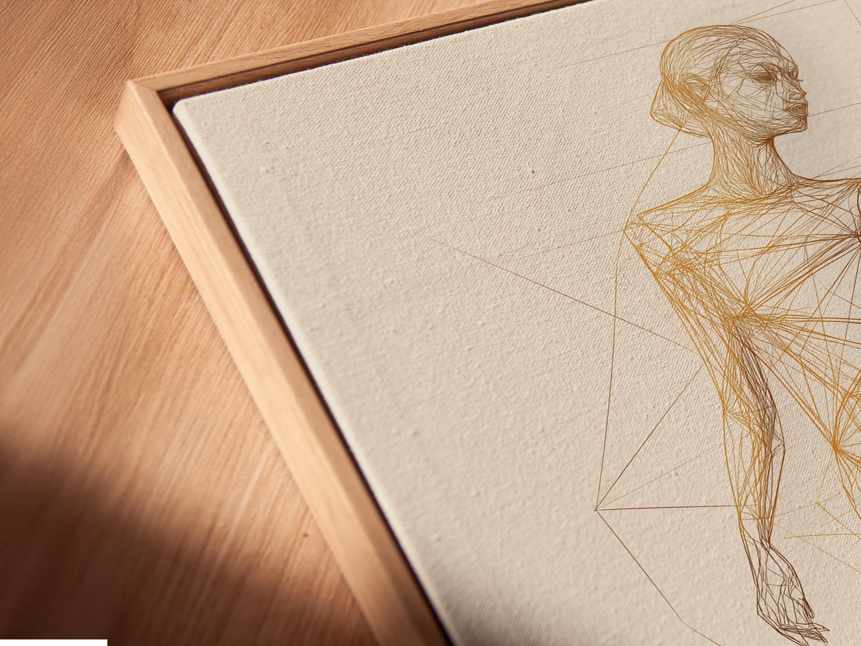 Minimalist gold line drawing of a standing woman with faint geometric grid lines detail view