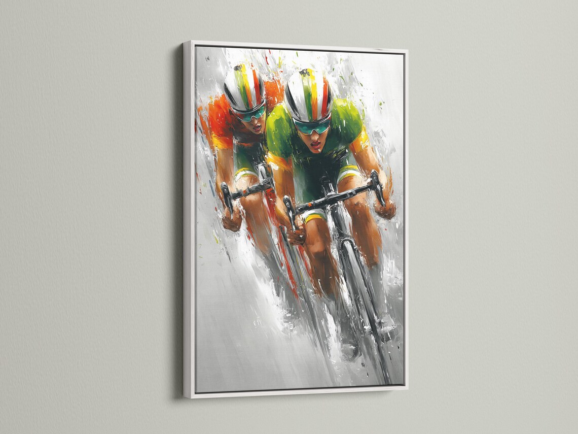 Cycling artwork mockup showing a framed print with two cyclists racing diagonally