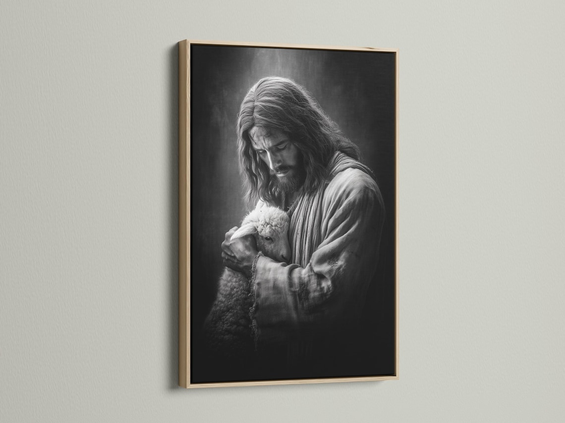 Framed black and white artwork of a shepherd holding a lamb shown on a wall mockup