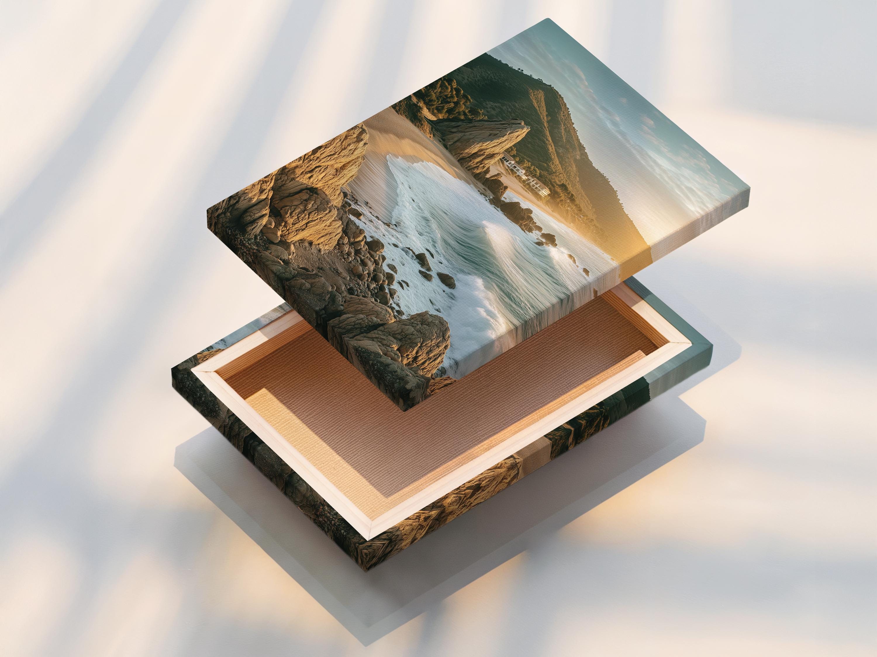 Golden hour seascape showing sandy shore, foamy waves, rocky cliffs and headland detail view