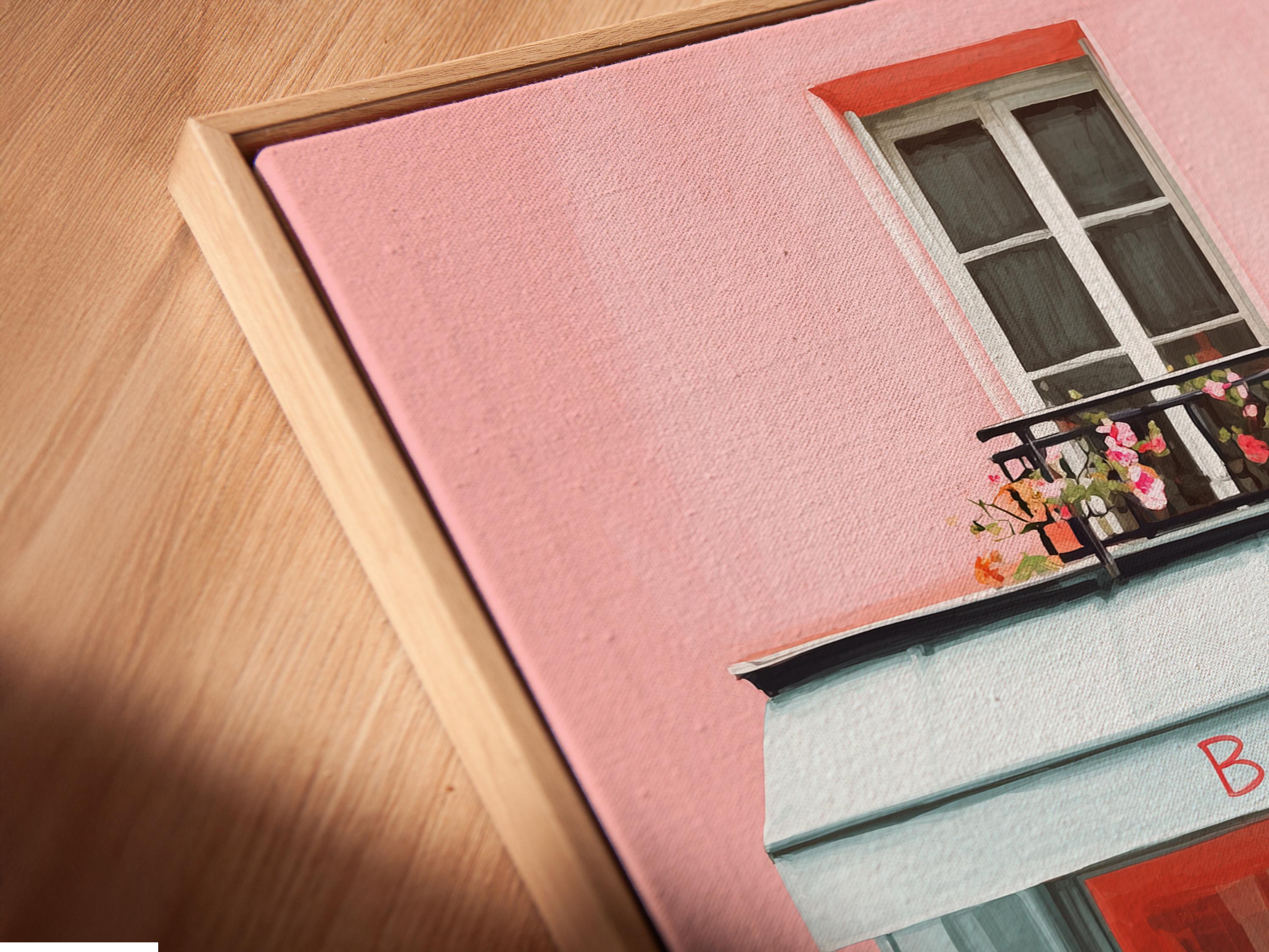 Room mockup showing a framed pastel bakery shopfront illustration