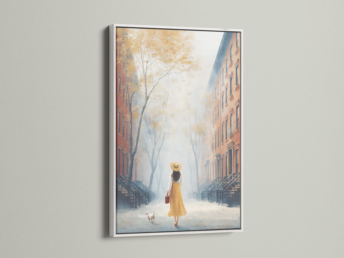Room mockup showing a framed painterly city street scene with a woman walking a small dog