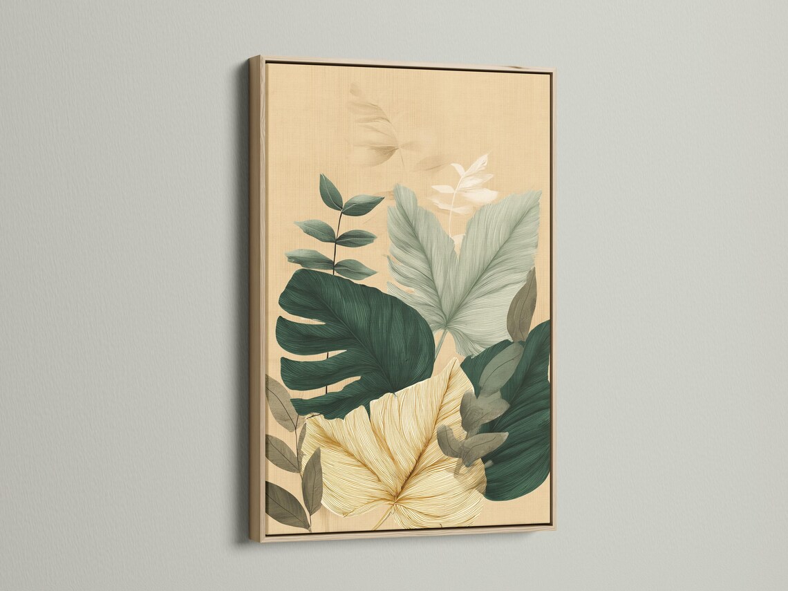 Framed botanical artwork featuring tropical leaves in green and teal on a beige background