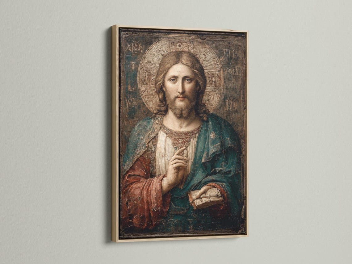Mockup showing framed antique Jesus portrait on a wall with rolled art and other frames nearby
