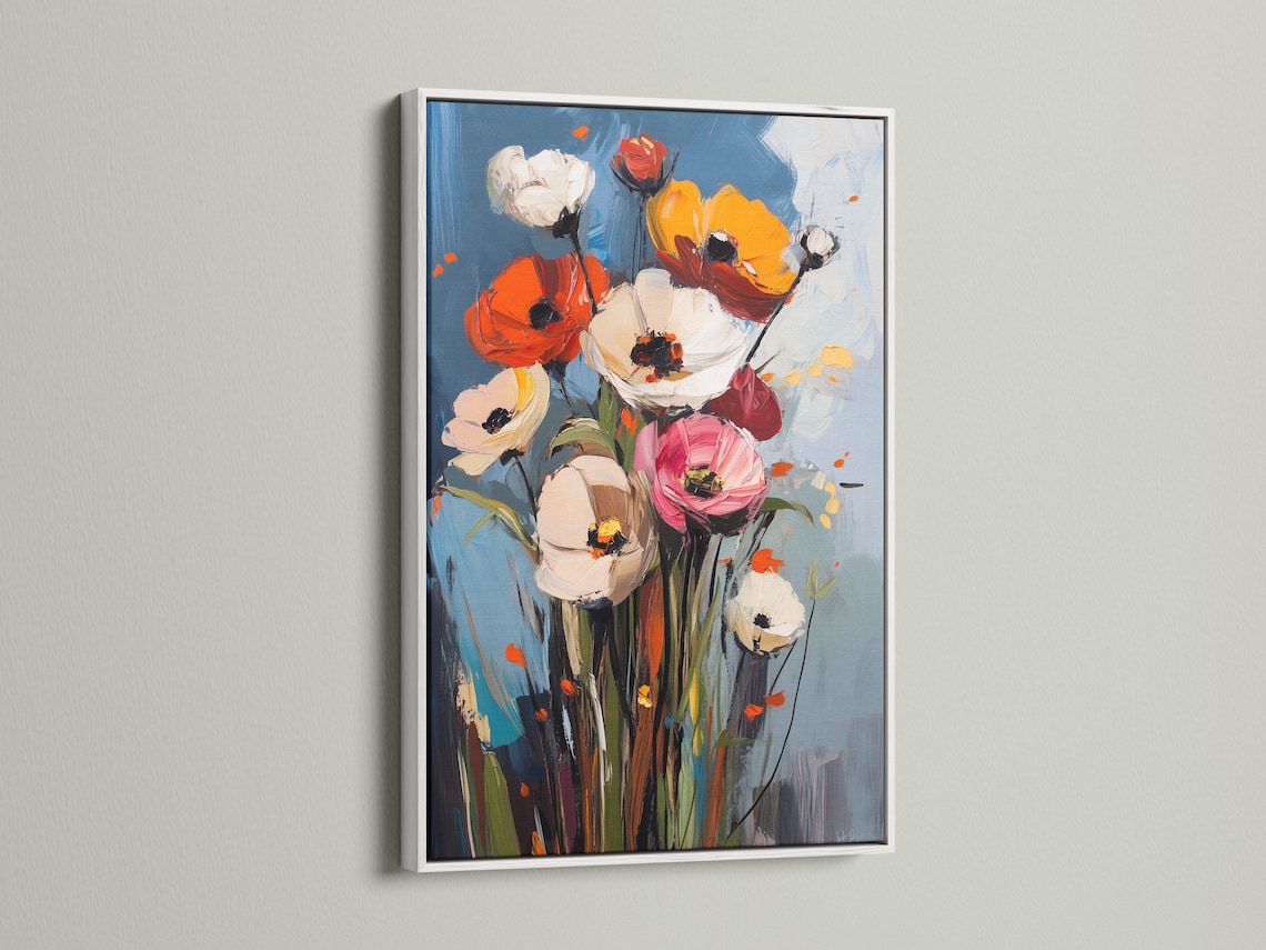 Room mockup showing framed floral artwork with poppy-like blooms and a blue background
