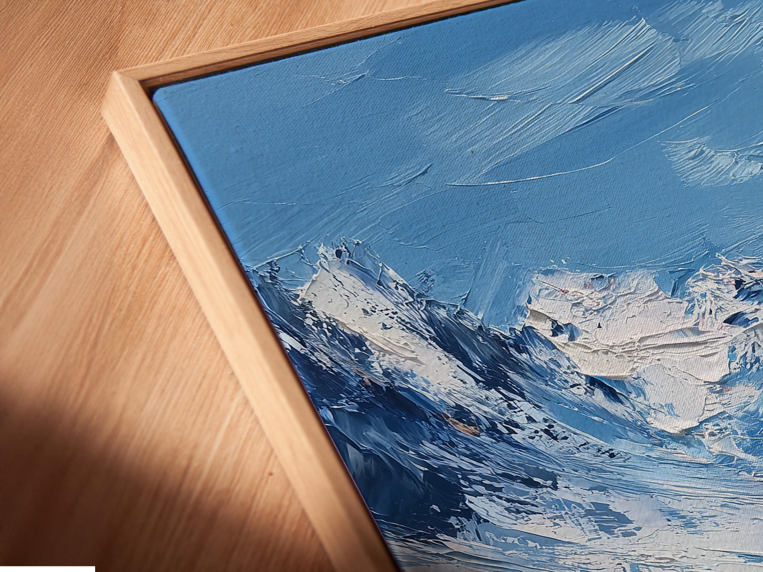 Mockup showing a framed snowy mountain artwork against a light background with rolled print pieces