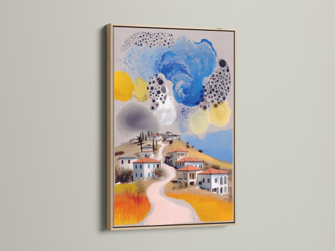 Room mockup featuring a framed stylised village landscape artwork with a swirling blue sky