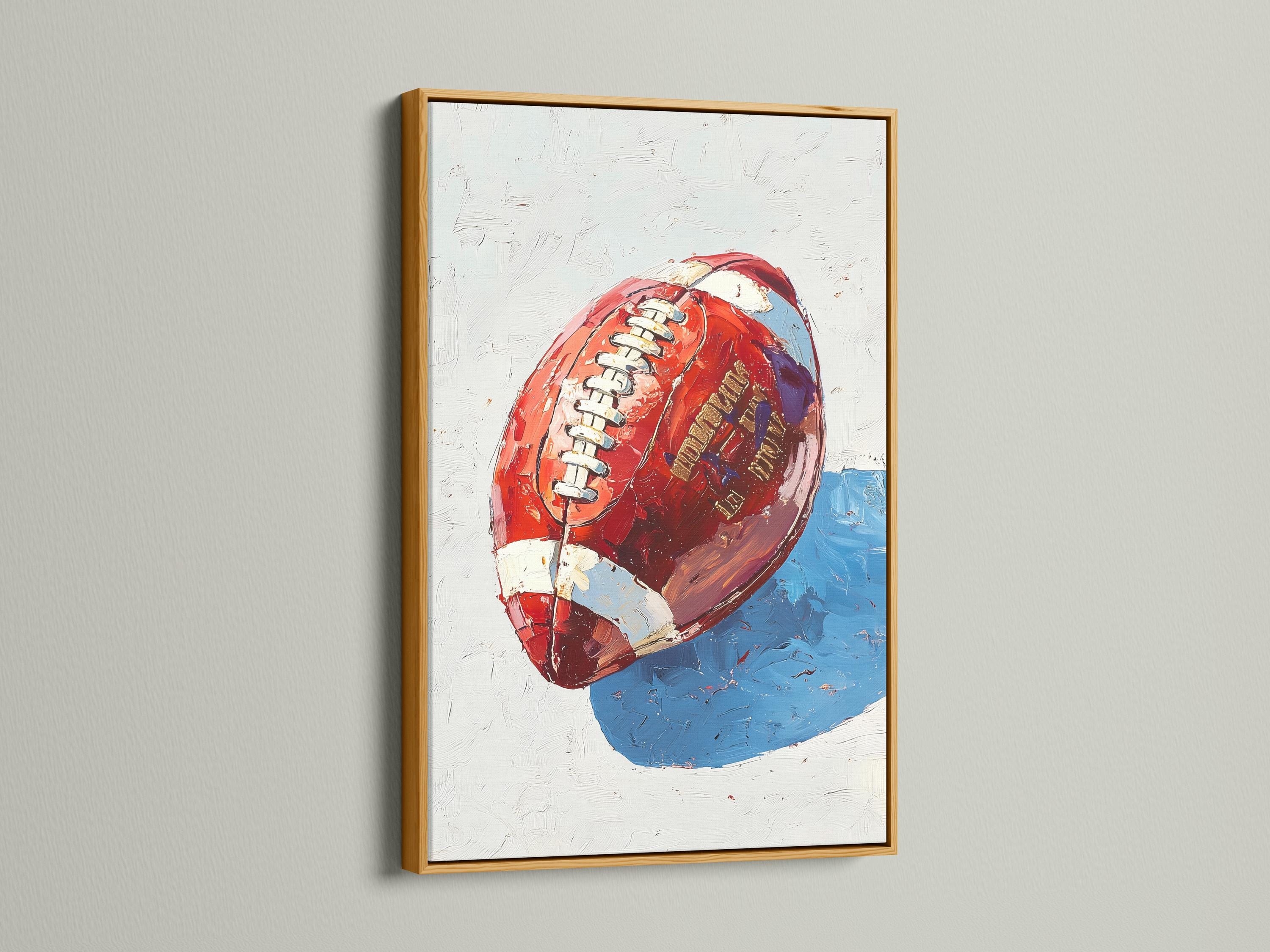 Stylised red and blue football artwork with a helmet-like face and stripe details detail view