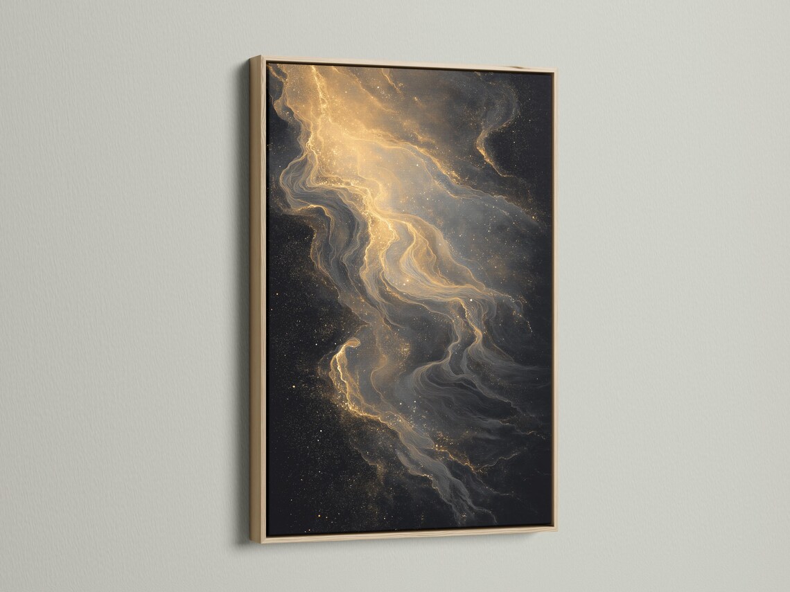 Room mockup showing a framed black and gold abstract artwork with gold dust trails