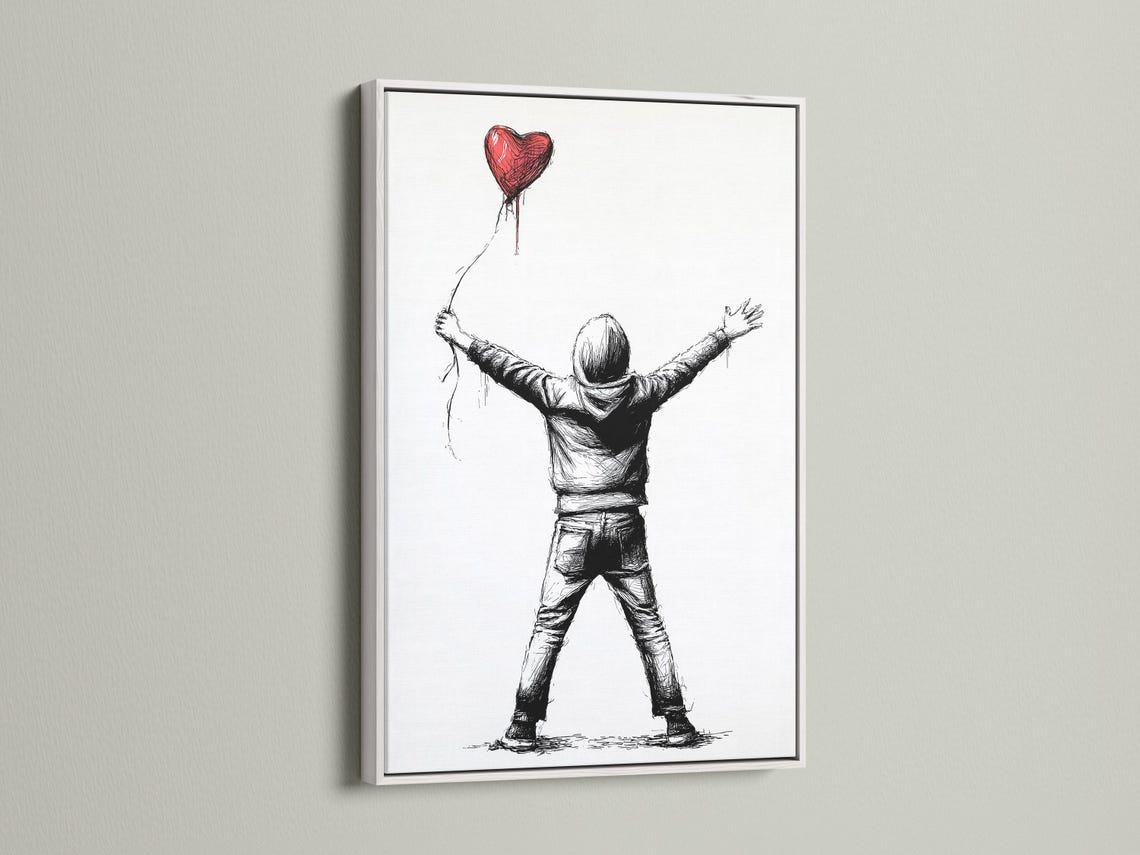 Framed wall art mockup showing a boy holding a red heart-shaped balloon