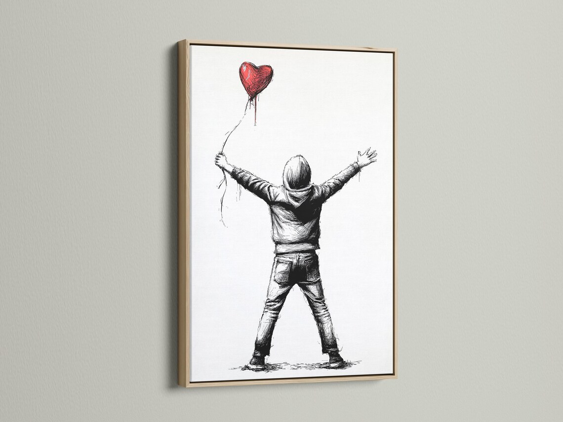 Framed wall art mockup showing a boy holding a red heart-shaped balloon