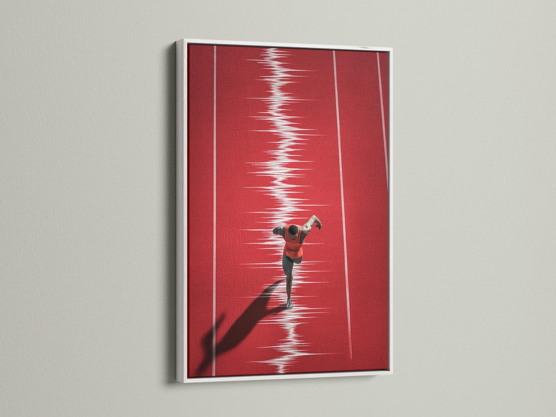 Mockup showing a framed red runner track artwork on a light wall