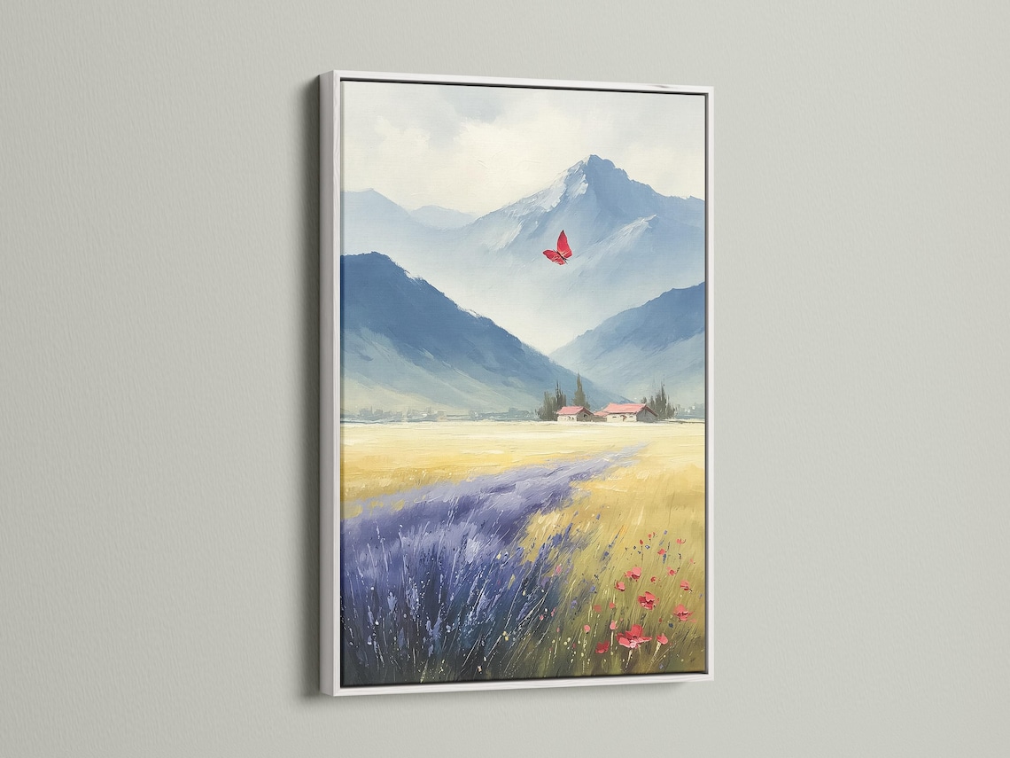 Room mockup showing a framed blue mountain landscape artwork with a red butterfly