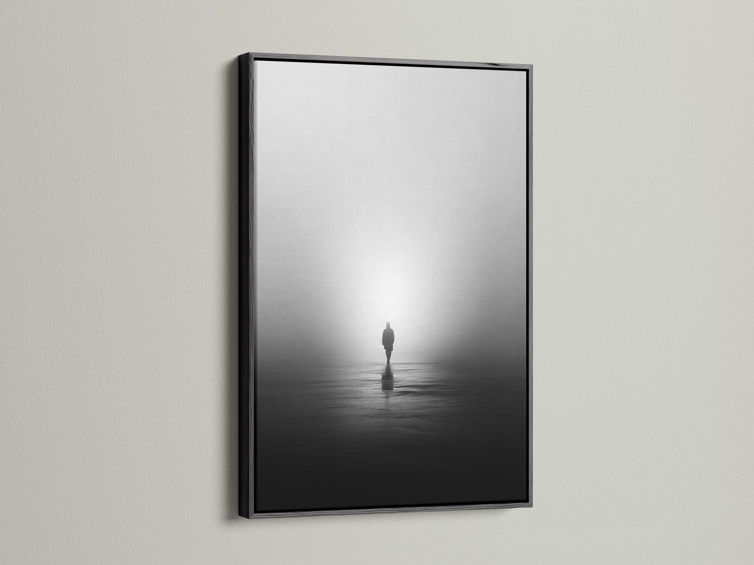 Monochrome misty shore scene with a solitary standing figure and reflection on dark water detail view