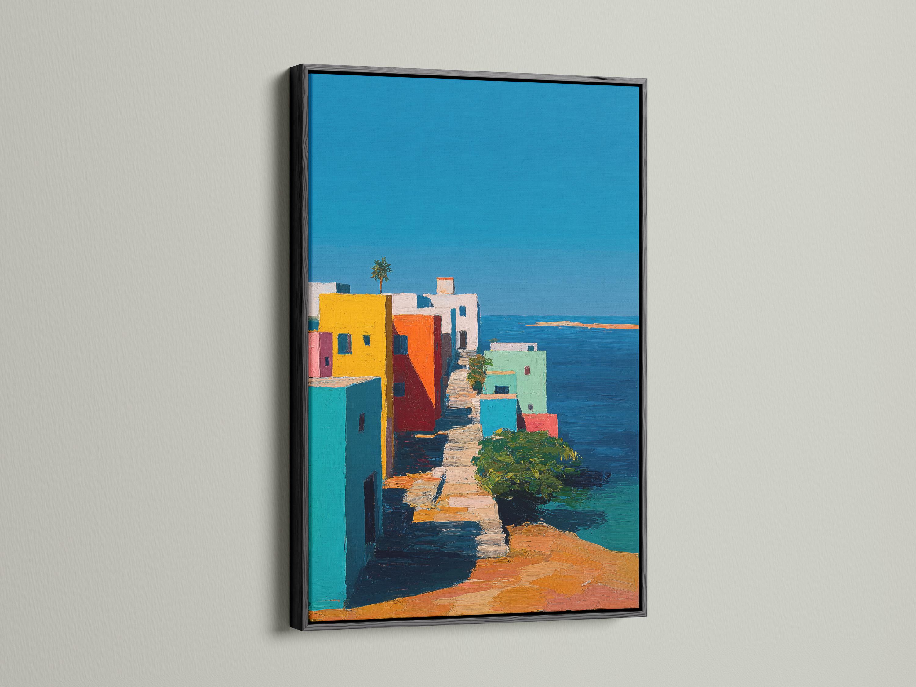 Wall mockup showing a framed coastal village artwork with colourful buildings and blue sky