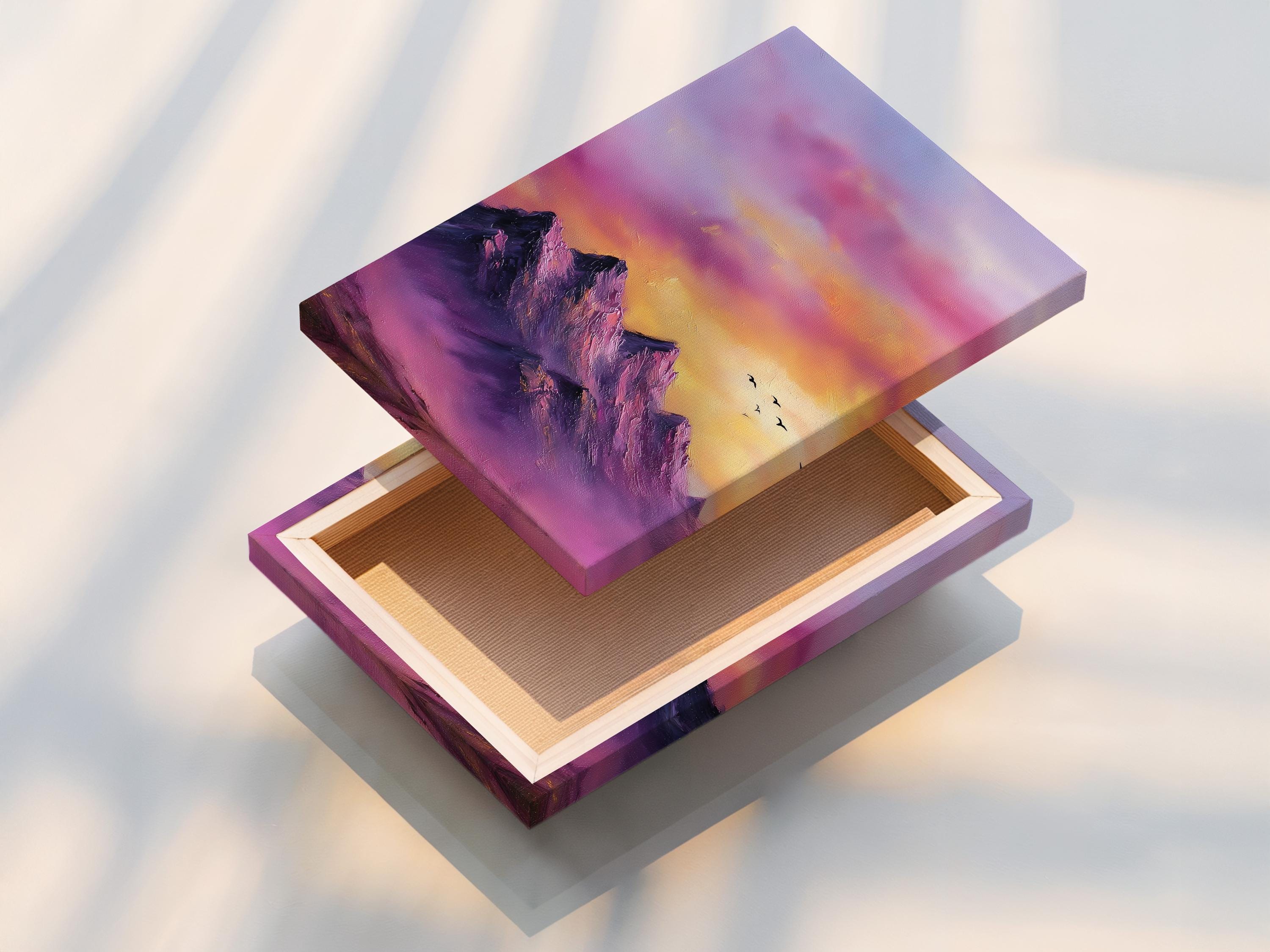 Purple and pink mountain sunset landscape with small birds in flight detail view