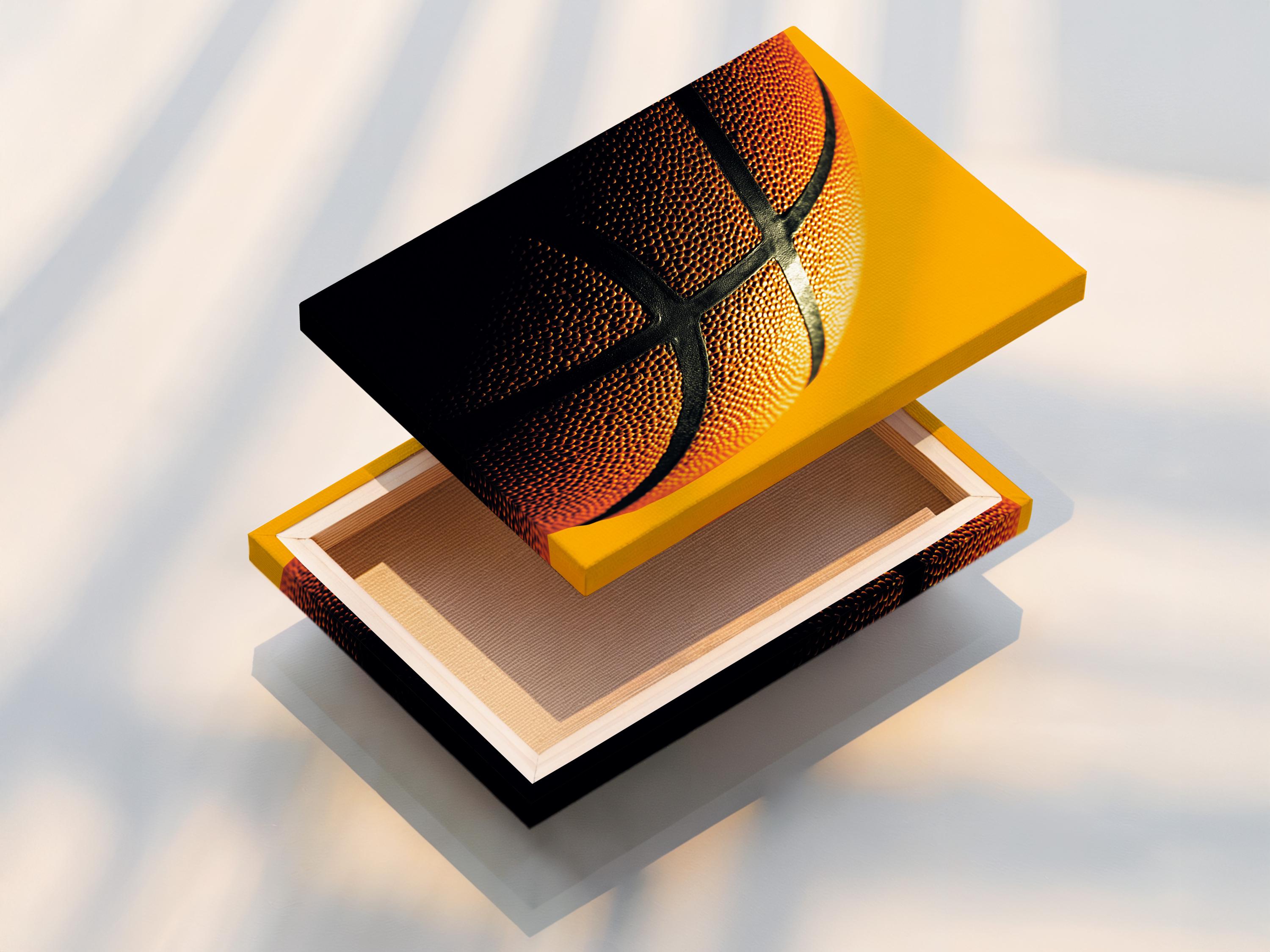 Close-up basketball surface with orange dimples and dark curved grooves
