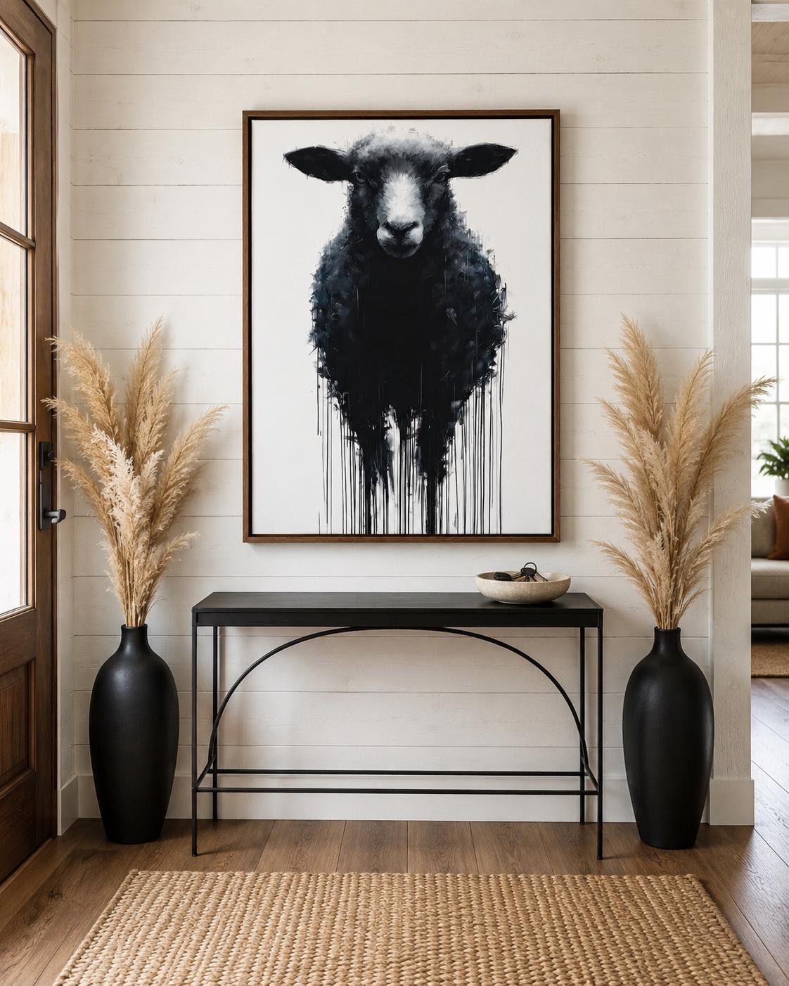 Sheep portrait artwork displayed in a bright industrial-style room