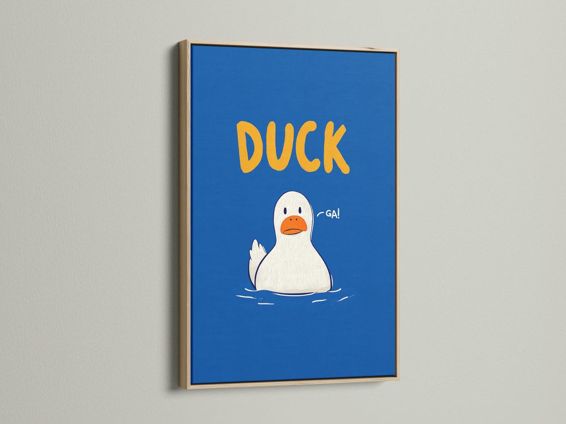 Room mockup showing blue framed duck artwork with orange “DUCK” text