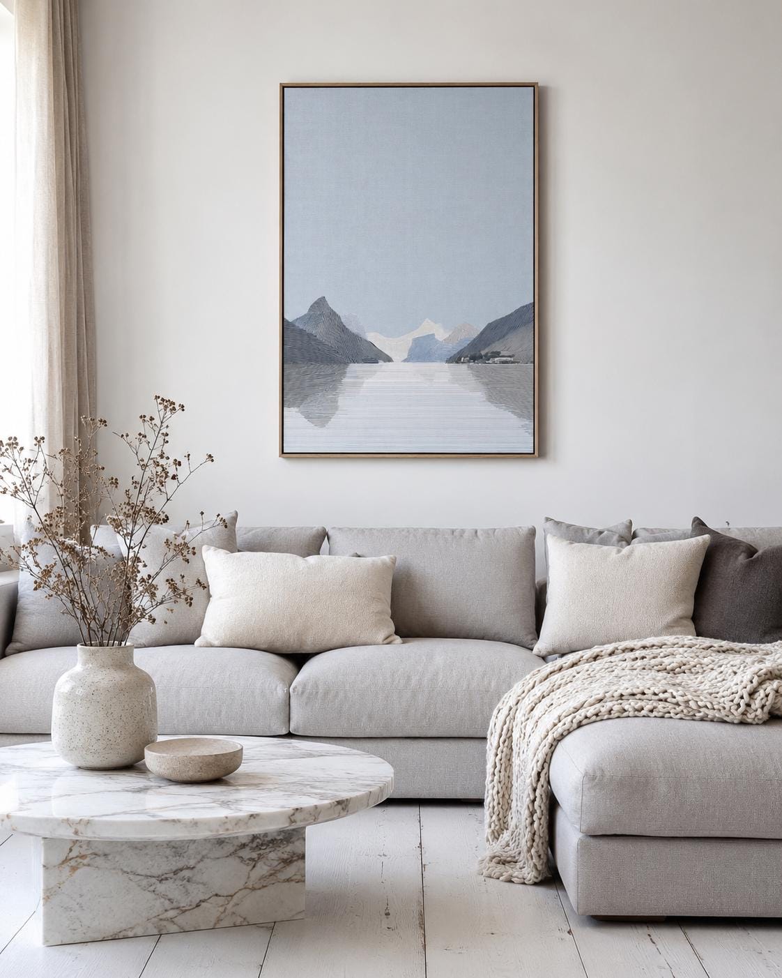 Person viewing an abstract mountain artwork in a modern room mockup