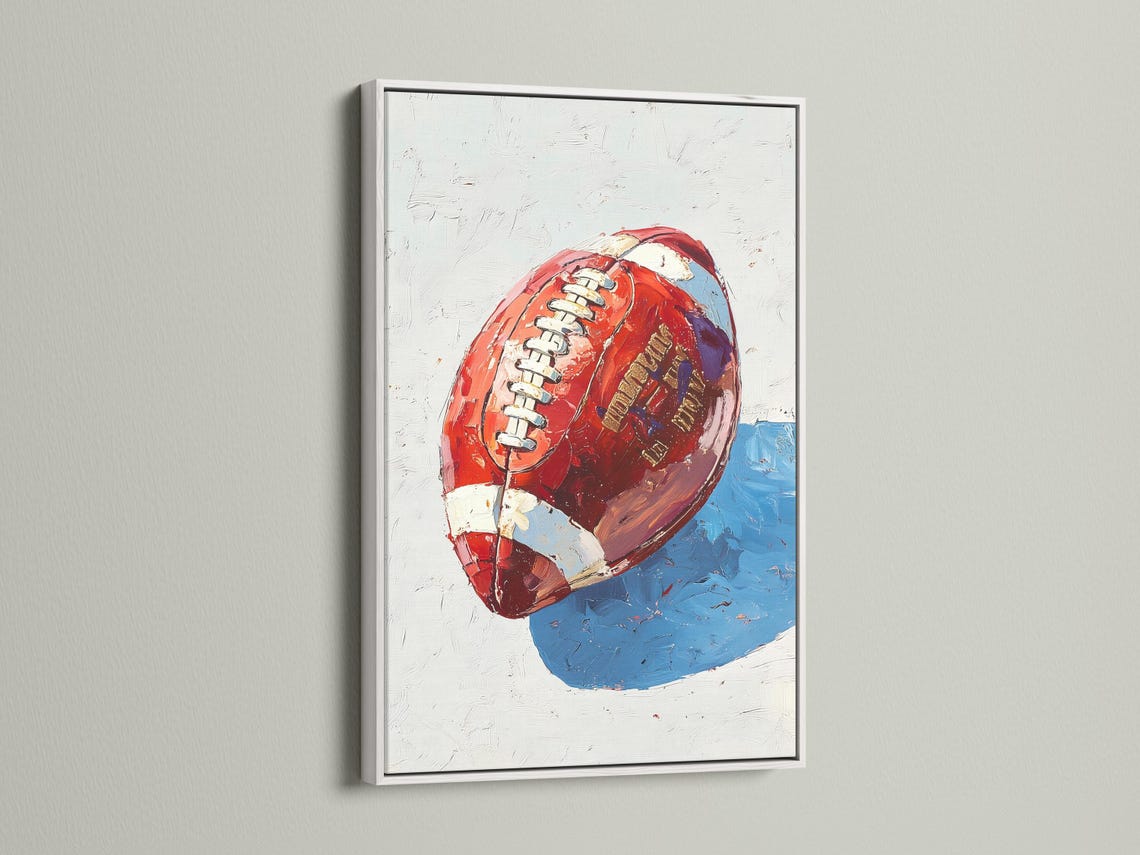 Stylised red and blue football artwork with a helmet-like face and stripe details detail view
