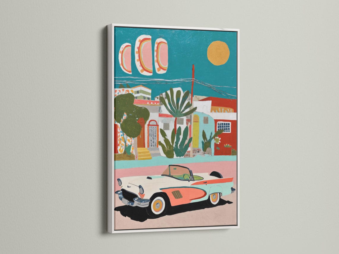 Retro car and coastal village artwork with teal sky and coral buildings detail view