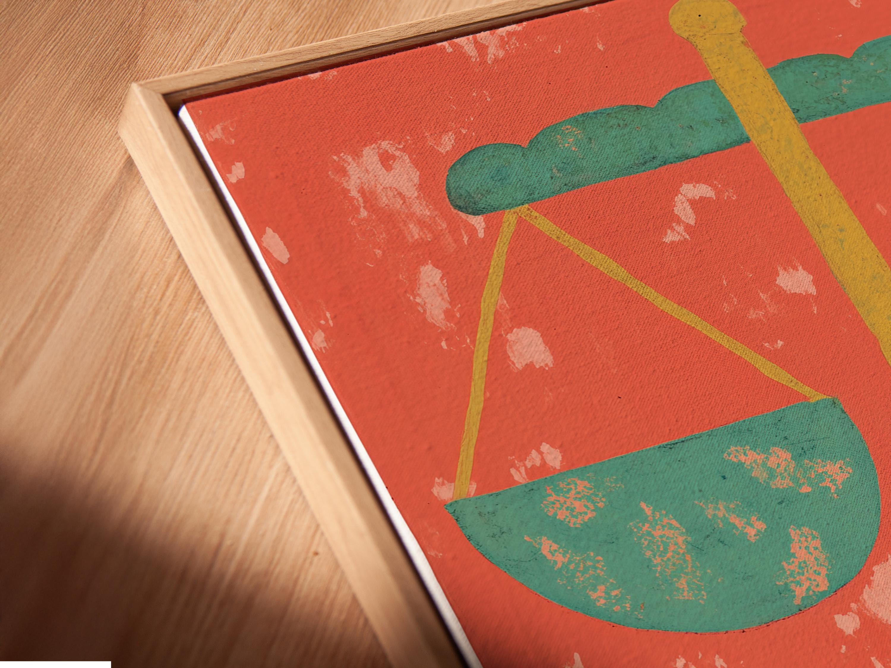 Stylised scales of justice with mint-green pans and gold beam on a coral-red distressed background detail view