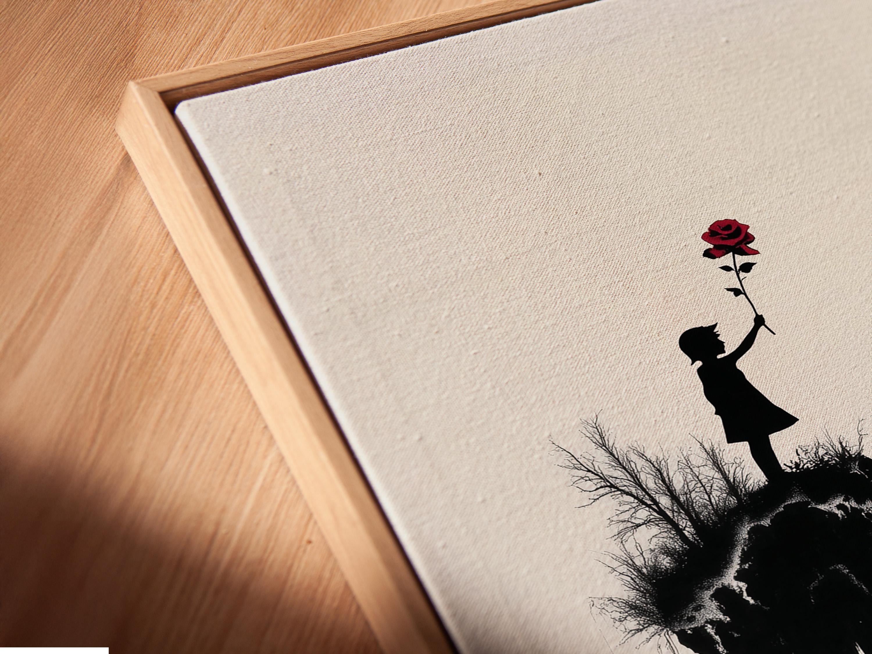 Room mockup showing a framed artwork of a monochrome mountain scene with a girl silhouette holding a red rose