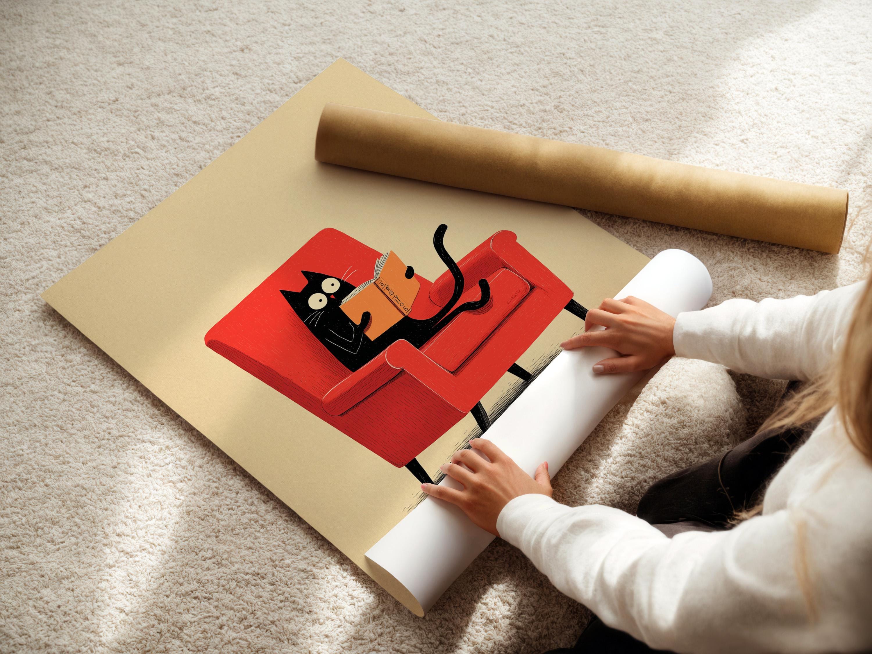 Illustrated black cat reading an orange book while seated in a red armchair detail view