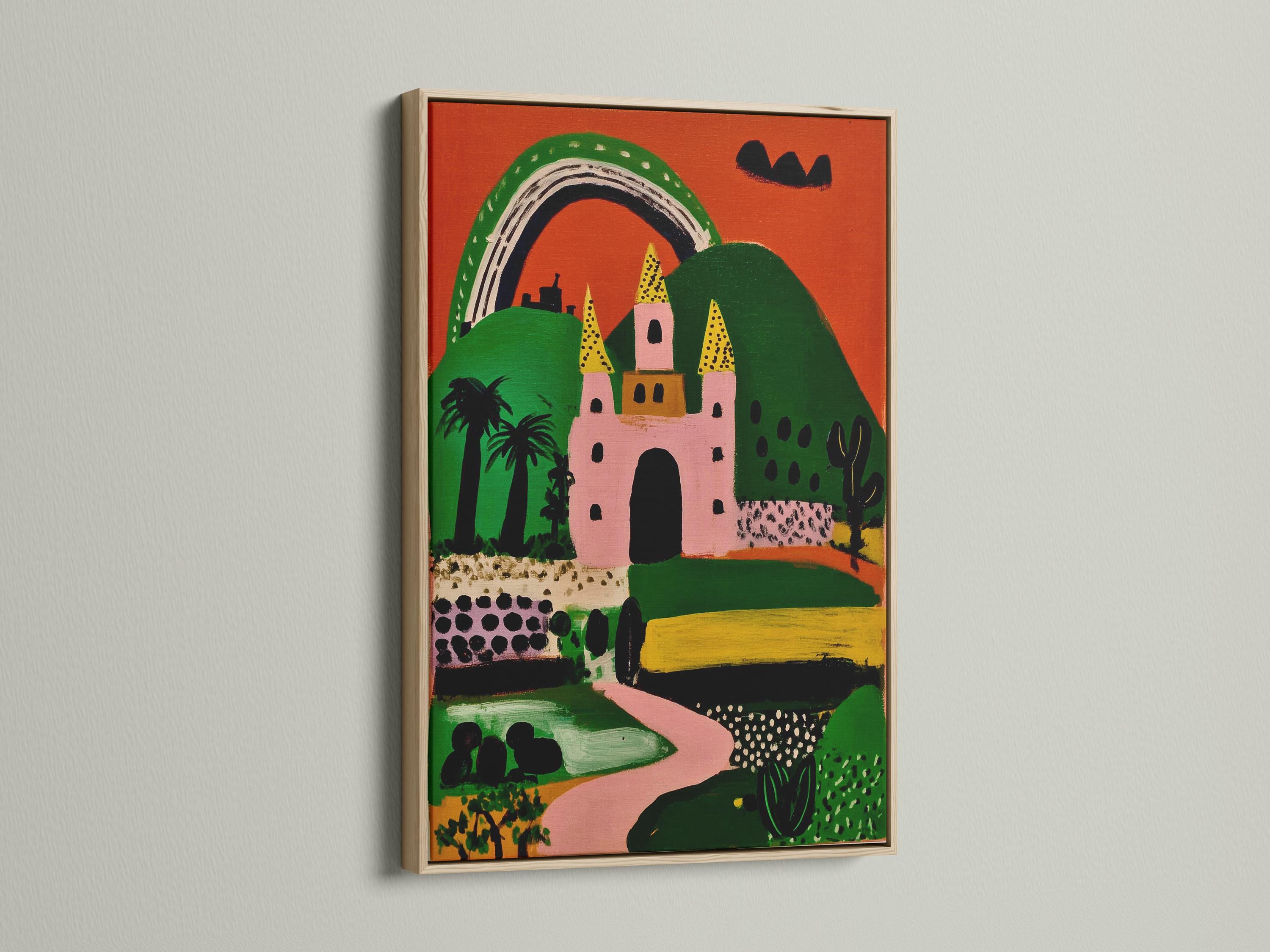 Whimsical pink and green castle with a rainbow arch and yellow tower shapes detail view
