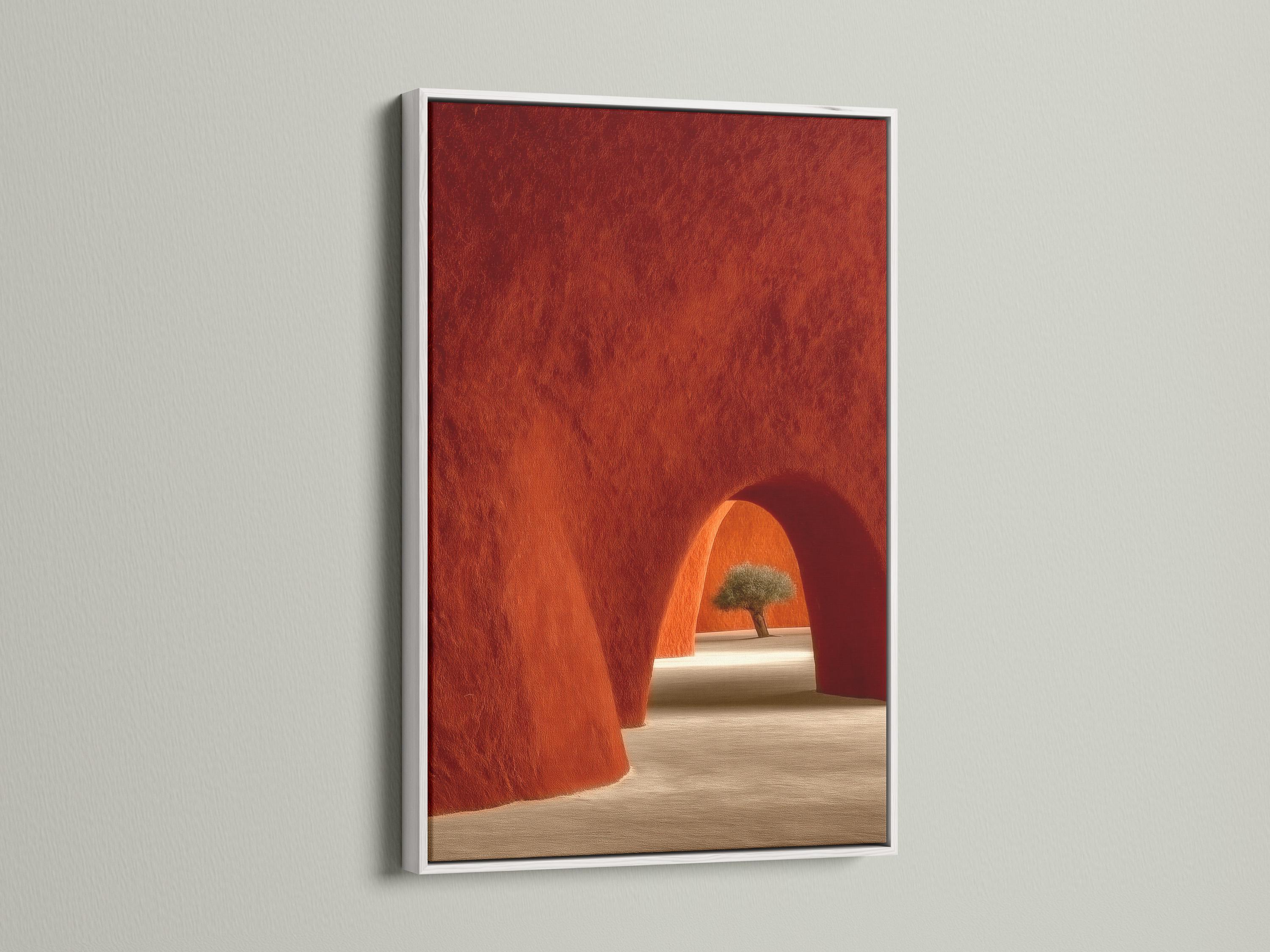 A warm terracotta adobe-style archway scene with a sandy floor, deep red walls, and a single tree in sunlight, presented in a textured, painterly