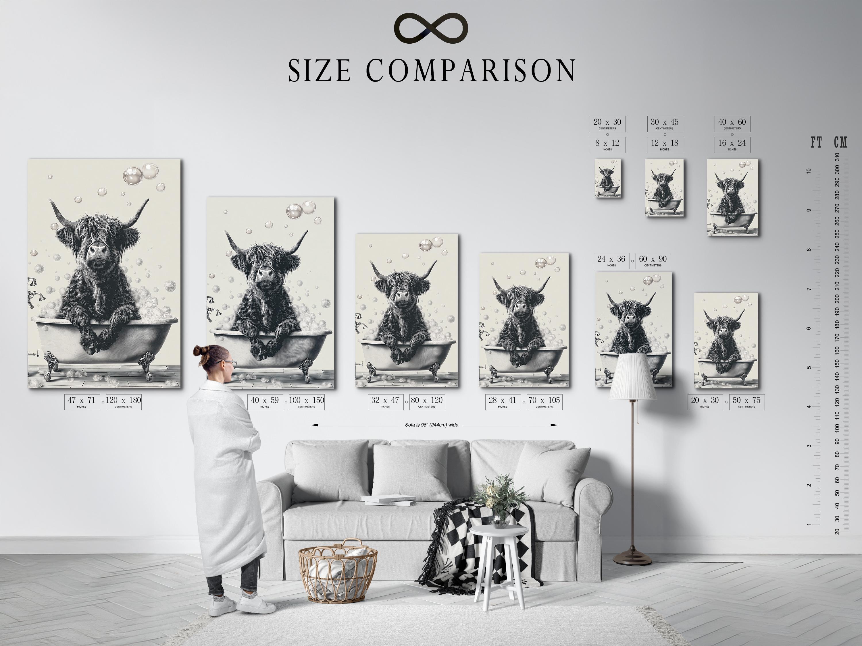 Woman holding a mug standing beside a framed monochrome highland cow bathtub artwork