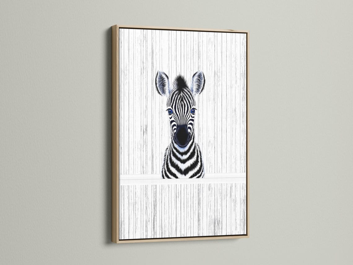 Room mockup showing framed zebra portrait wall art with black and white stripes and blue eyes