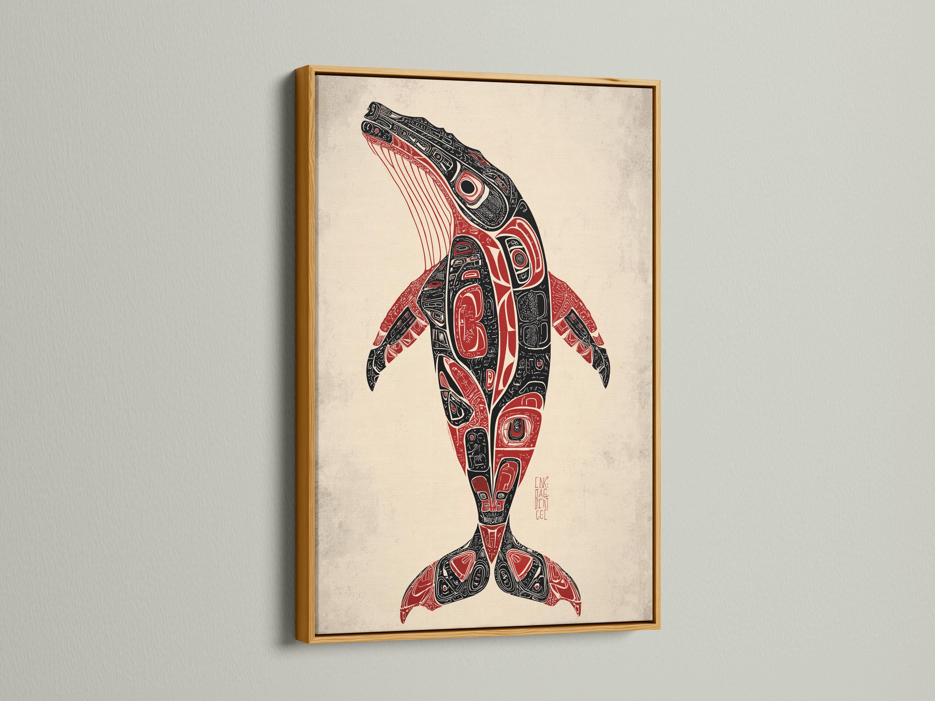 Man holding a mug beside a framed whale artwork in a rustic cabin setting