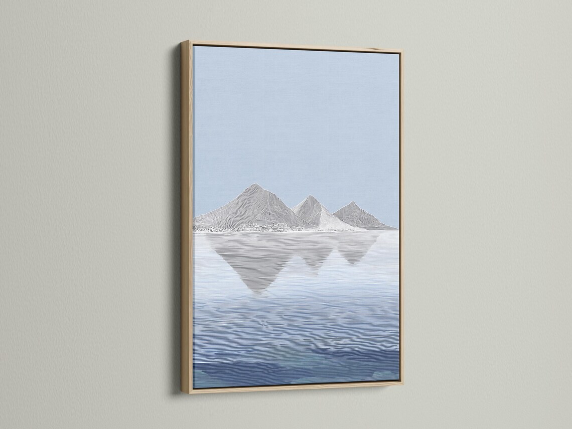 Wall mockup showing a framed blue minimalist mountain reflection landscape artwork