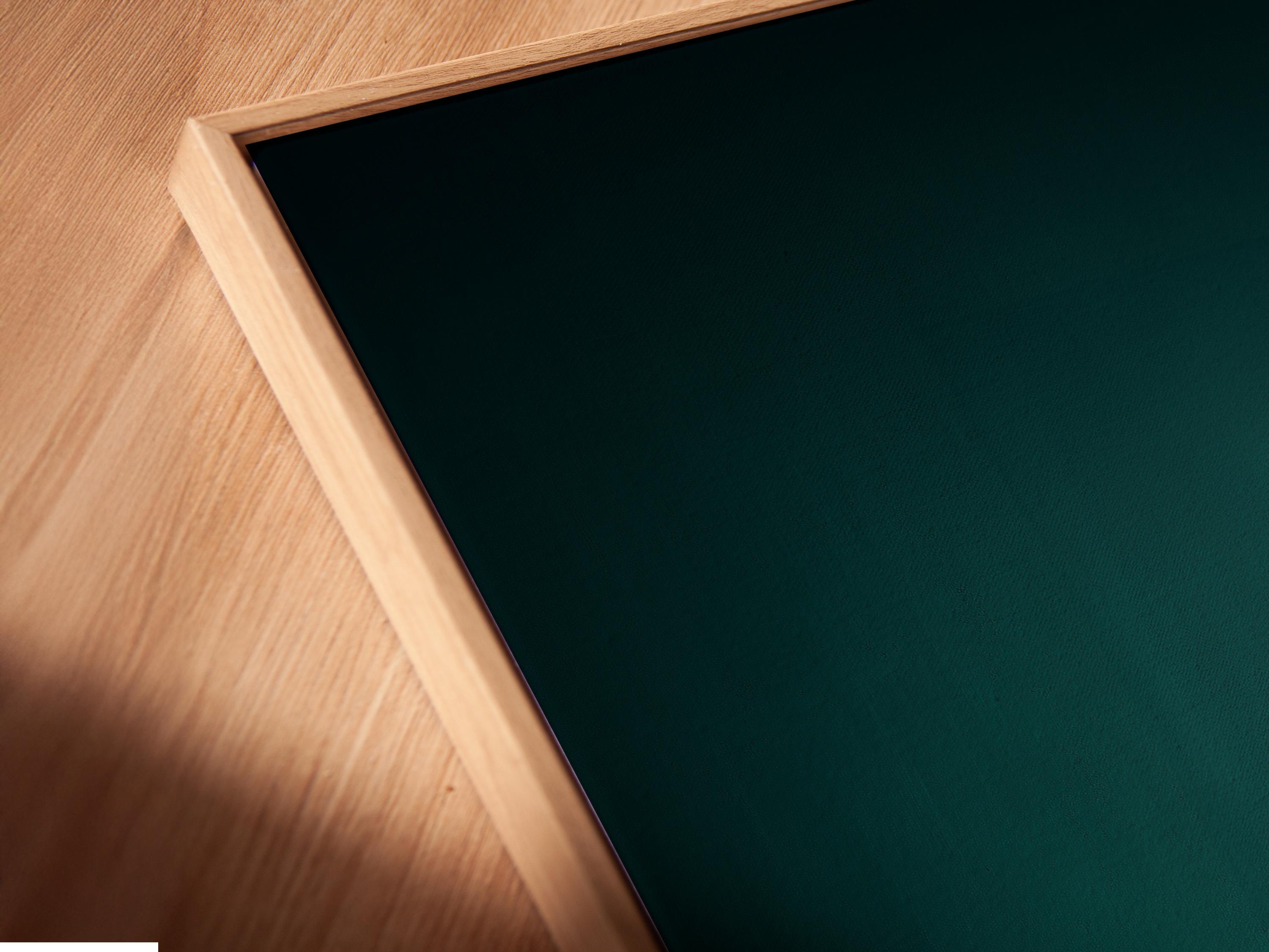 Wall mockup showing a framed teal sports car artwork with smaller preview thumbnails