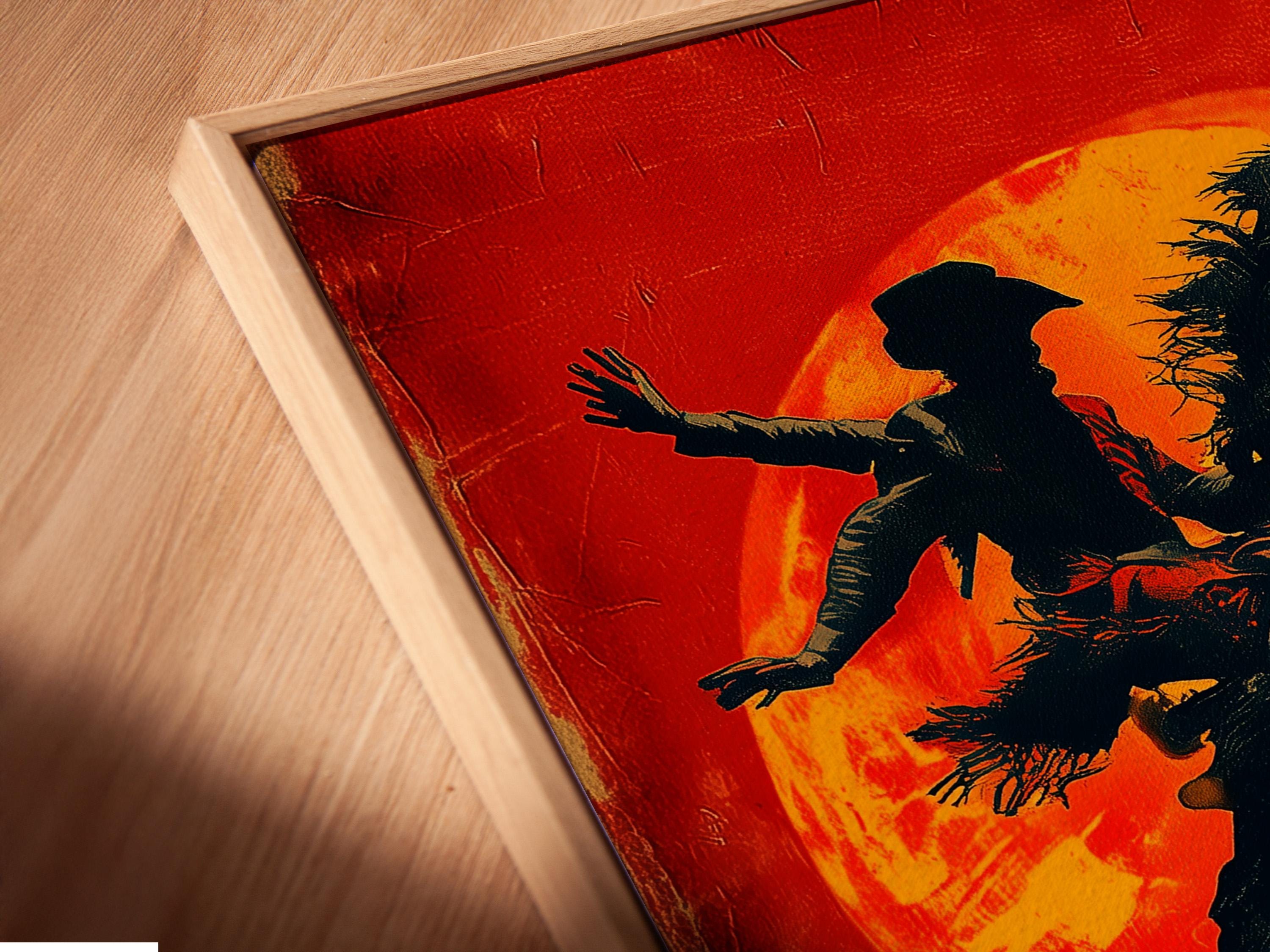 Silhouette of a cowboy riding a horse against a glowing orange sun on a red textured background detail view
