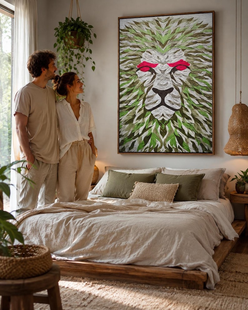 Stylised lion head made from layered green leaves with red eyes