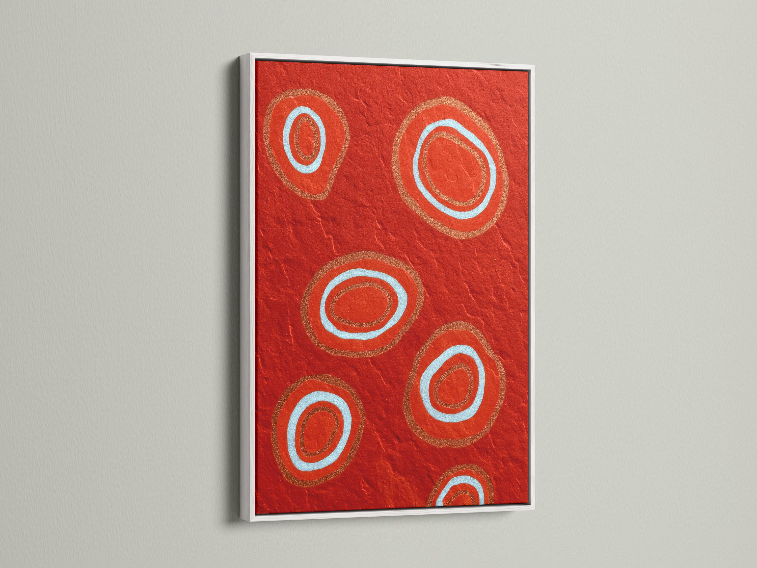 Room mockup showing a red abstract artwork with concentric circle motifs in pale blue and copper tones