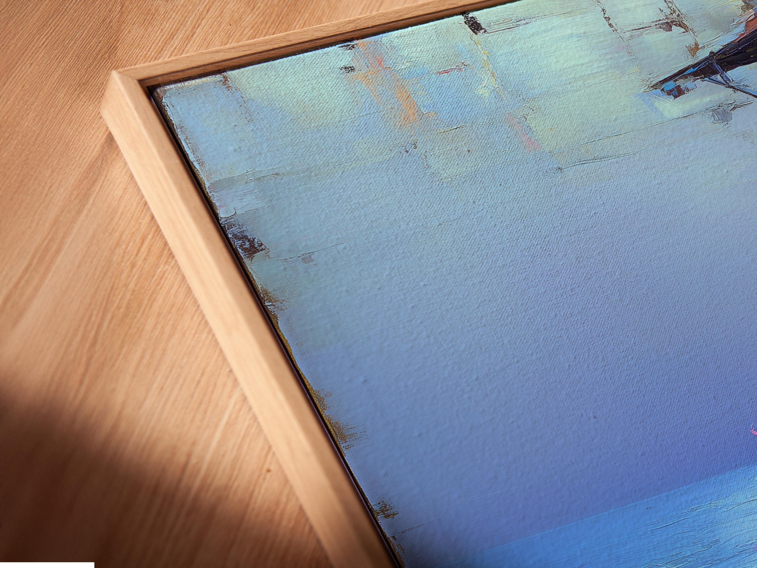 Room mockup showing a framed blue seascape artwork with pink flowers