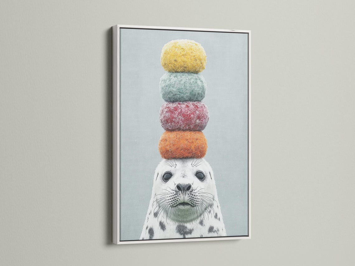Seal wall art mockup with stacked pastel pom-pom balls