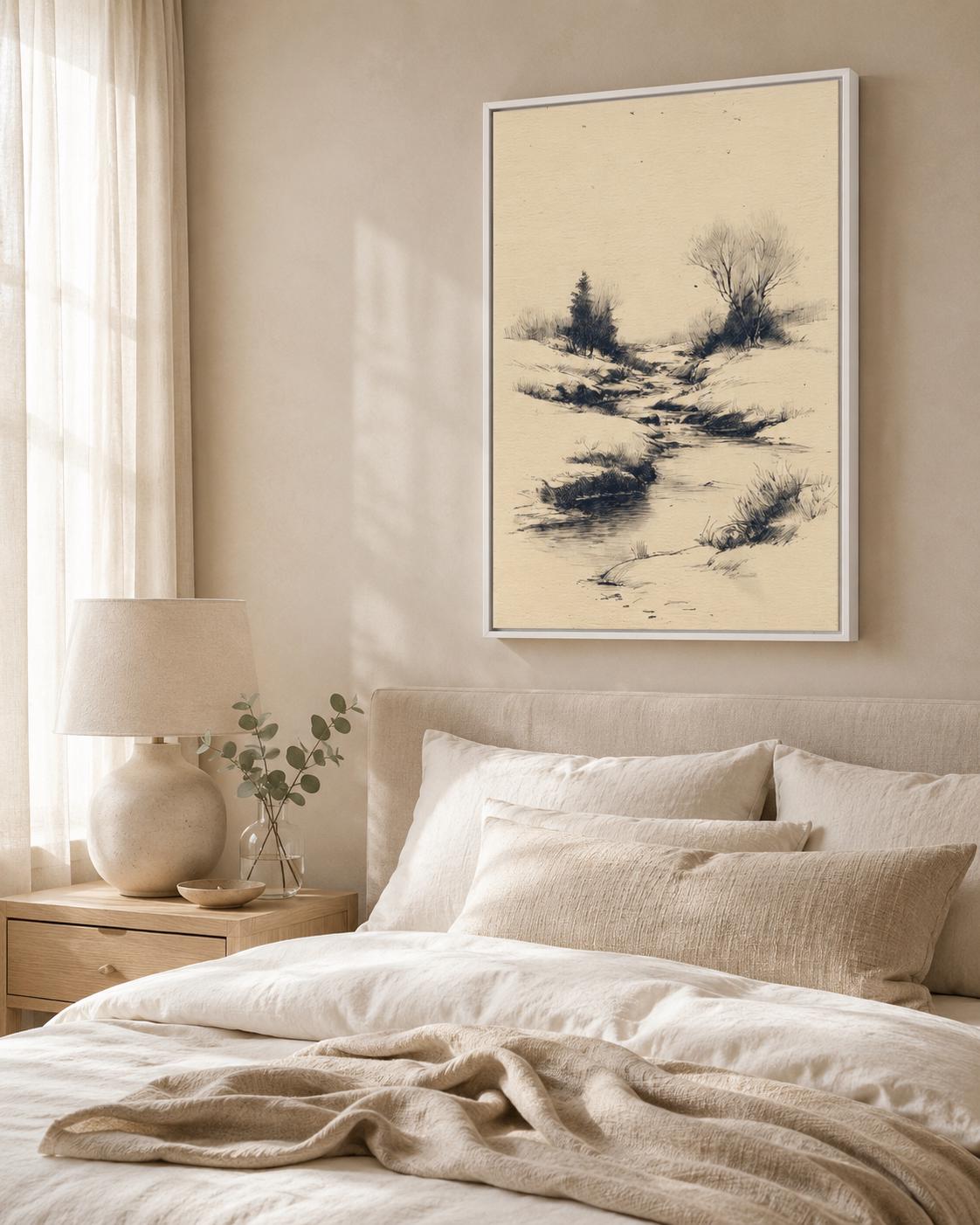 Woman holding a large framed beige river landscape sketch on a light wall in a bright room