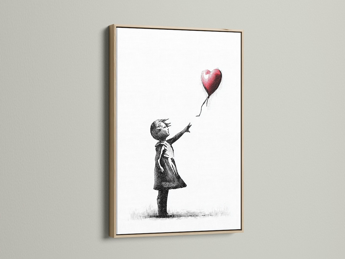 Room mockup showing a framed black and white girl sketch with a red heart balloon