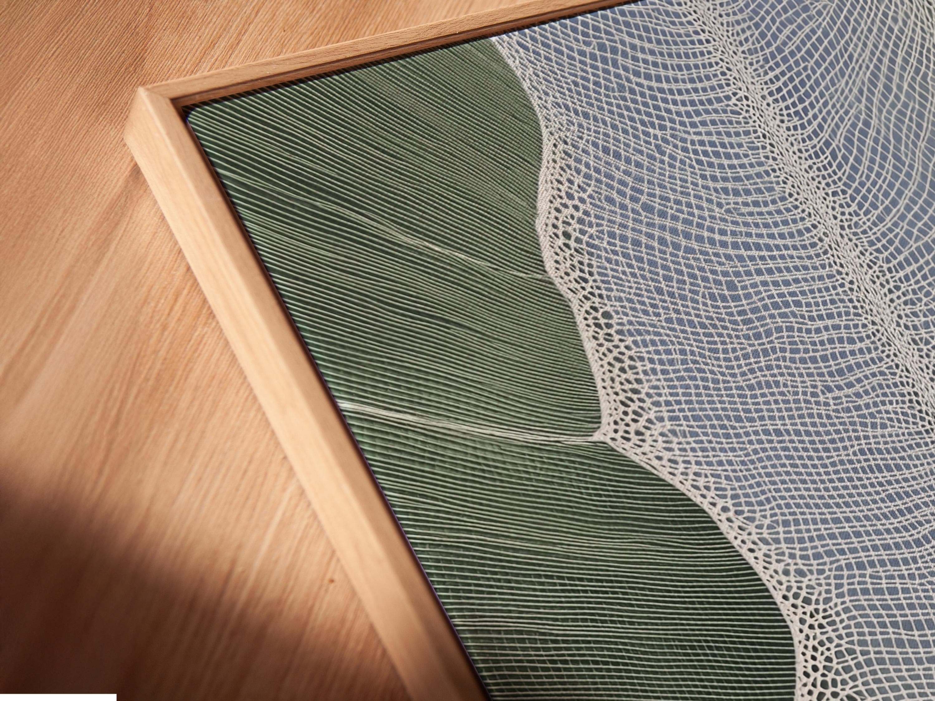 Sage green textured leaf silhouette artwork with a white net-like pattern detail view