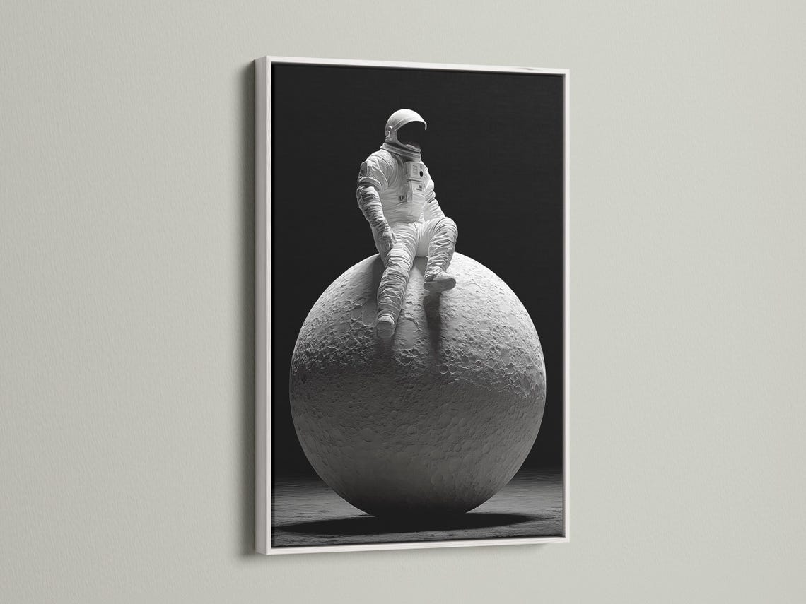 Monochrome astronaut in a space suit seated on a cratered moon against a dark background detail view