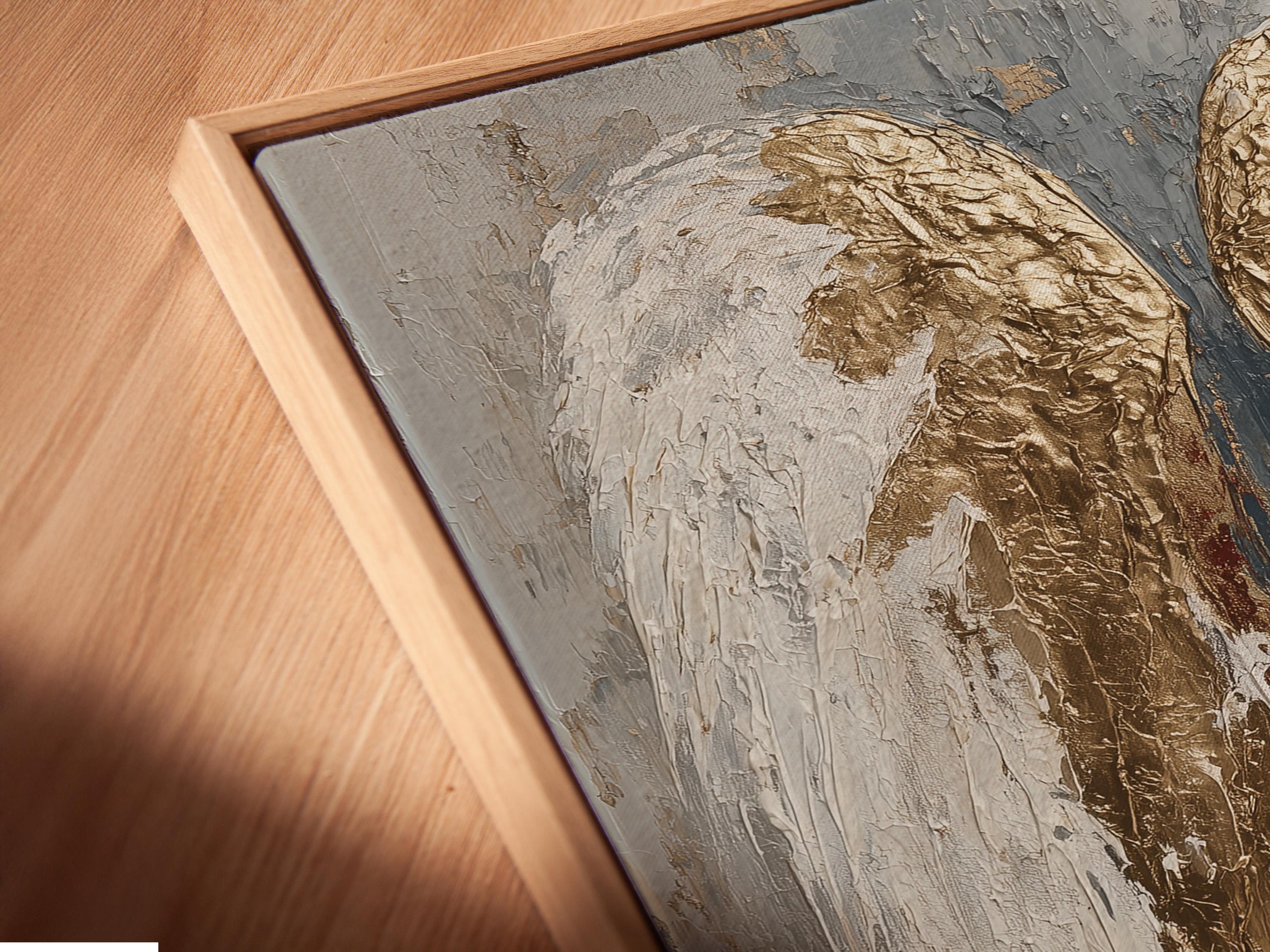 An angel-wing motif is shown symmetrically in layered white, grey and gold leaf-like tones, set against a textured neutral background detail view